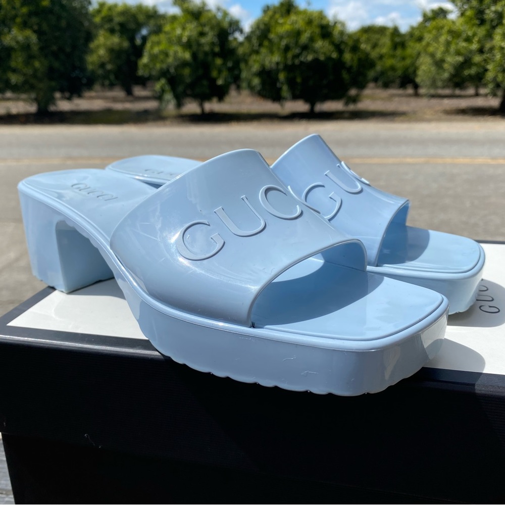 Pink and blue pair of Gucci rubber slide heels